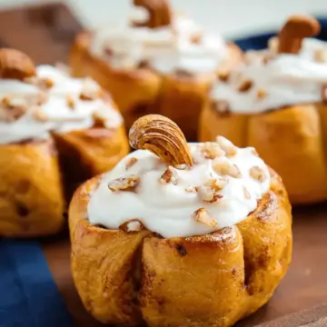 Pumpkin Shaped Cinnamon Rolls with Cream Cheese Frosting